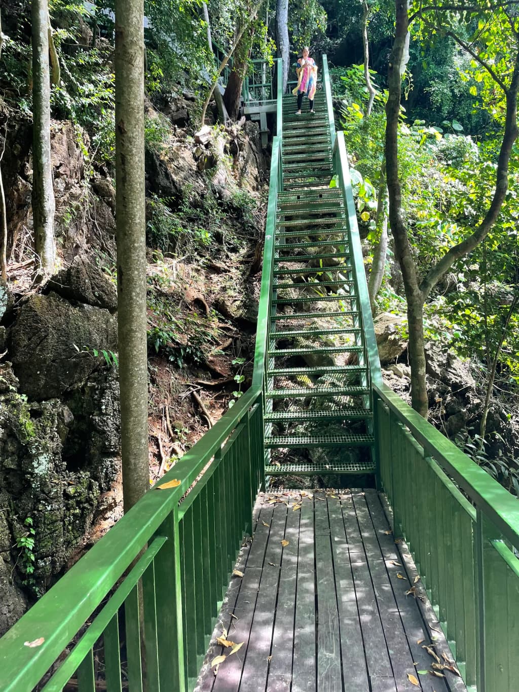 Limestone cliffs towering over emerald water - Photo by ekapan Atamakoolsri