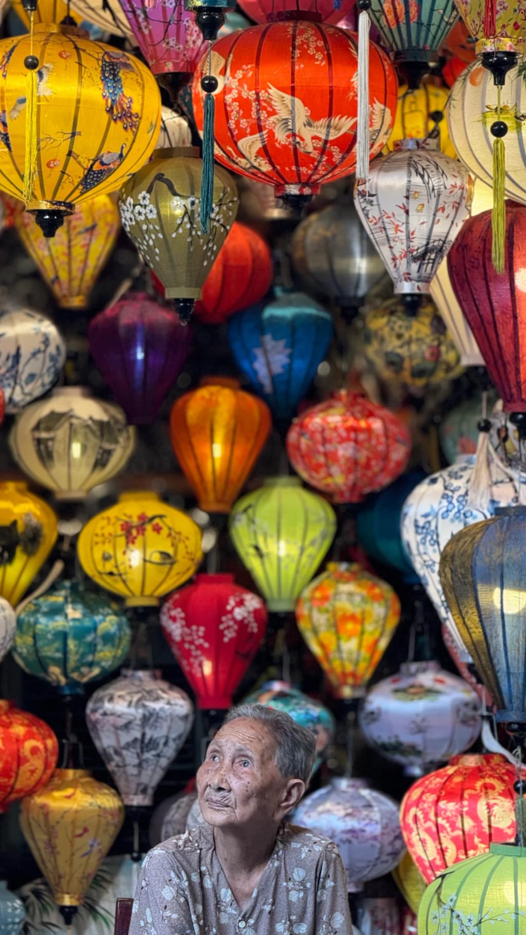 Yellow walls and colorful lanterns illuminate the ancient streets of Hoi An