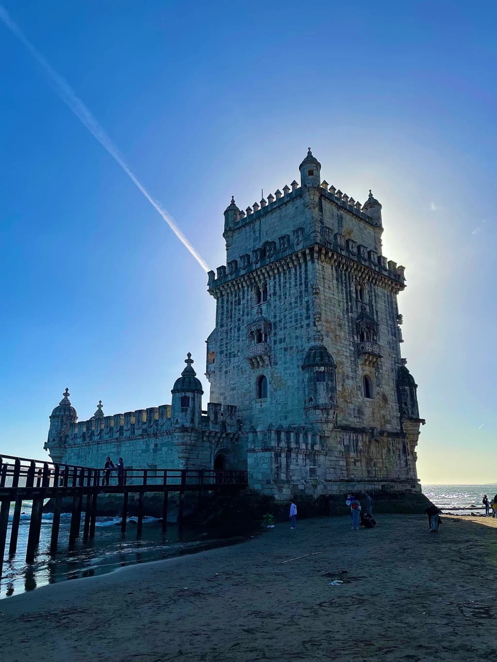 Sunlight hitting the intricate manueline stonework of Belém Tower