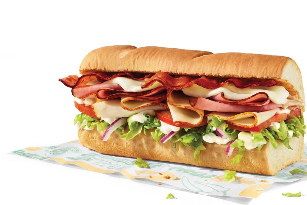 Passengers navigating the New York City subway turnstiles