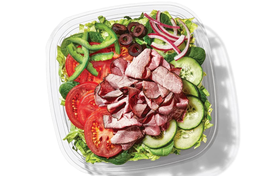 The blur of a subway train arriving at the platform