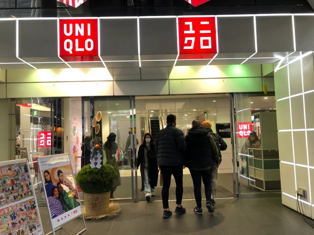 The towering glass facade of UNIQLO in Shibuya