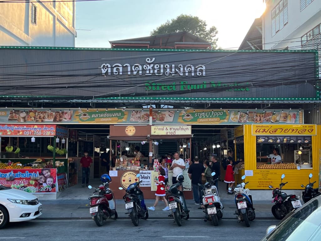 Bustling nighttime street food market in Thailand