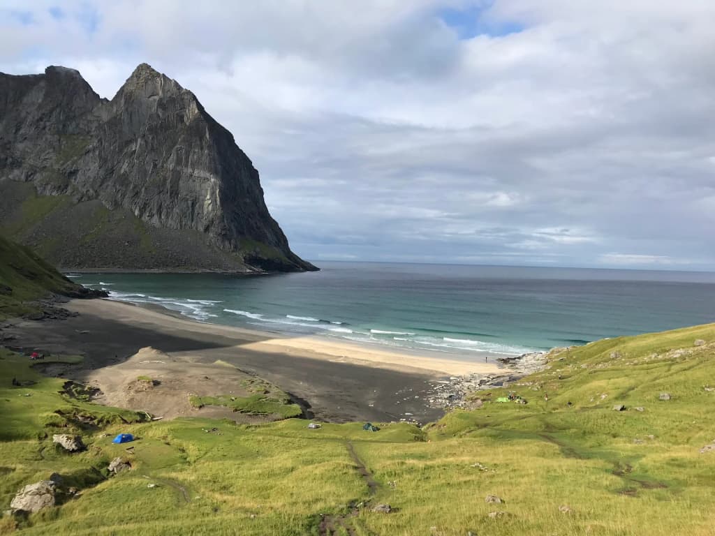 Looking down at the pristine turquoise waters of Kvalvika Beach