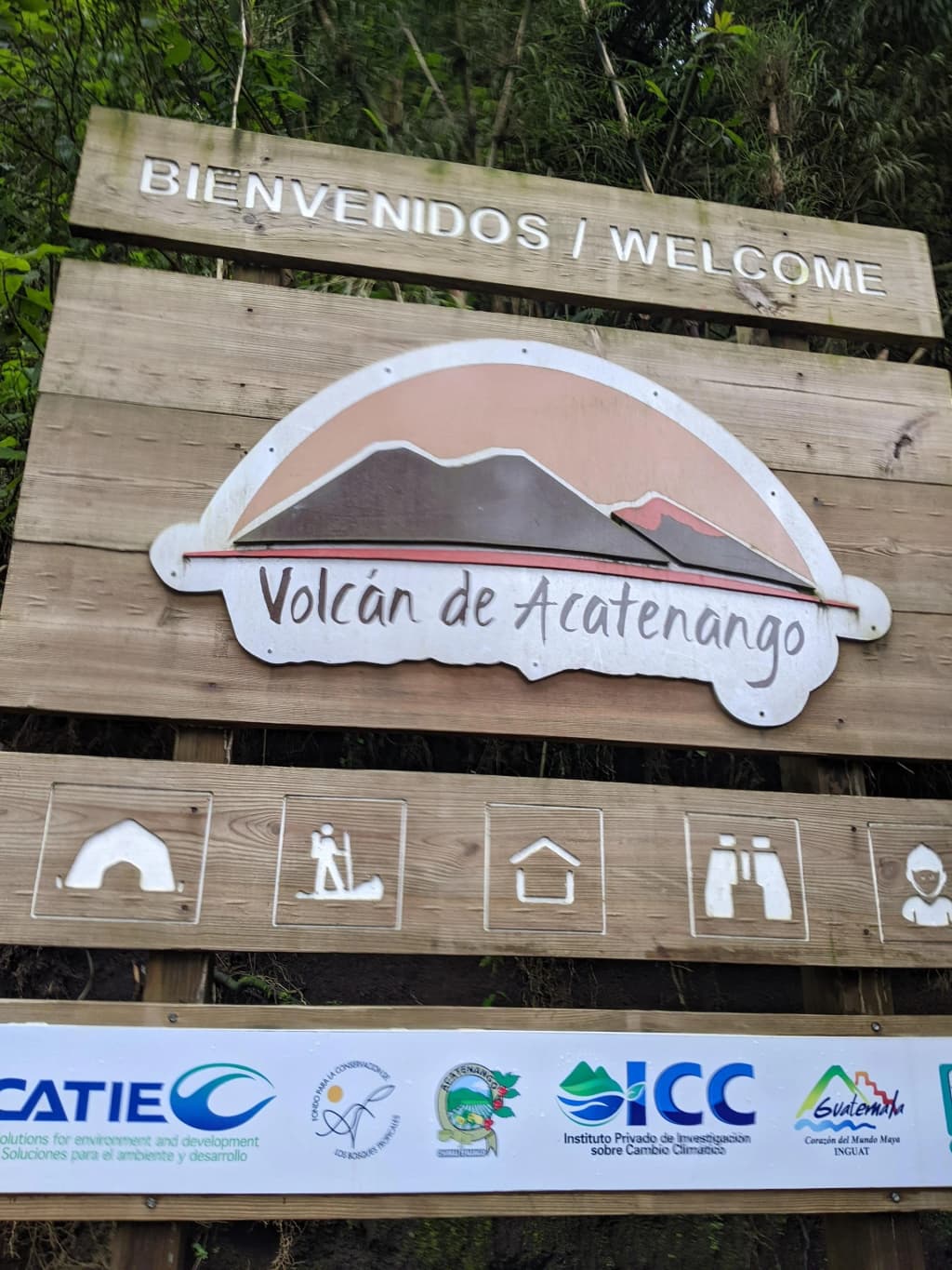 Lake Atitlán with volcanoes and colorful boats