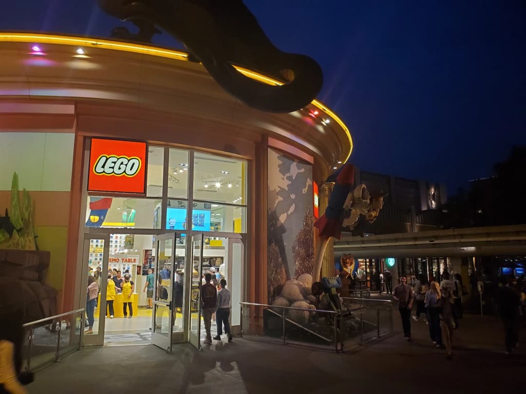 Crowds exploring the Downtown Disney District at twilight