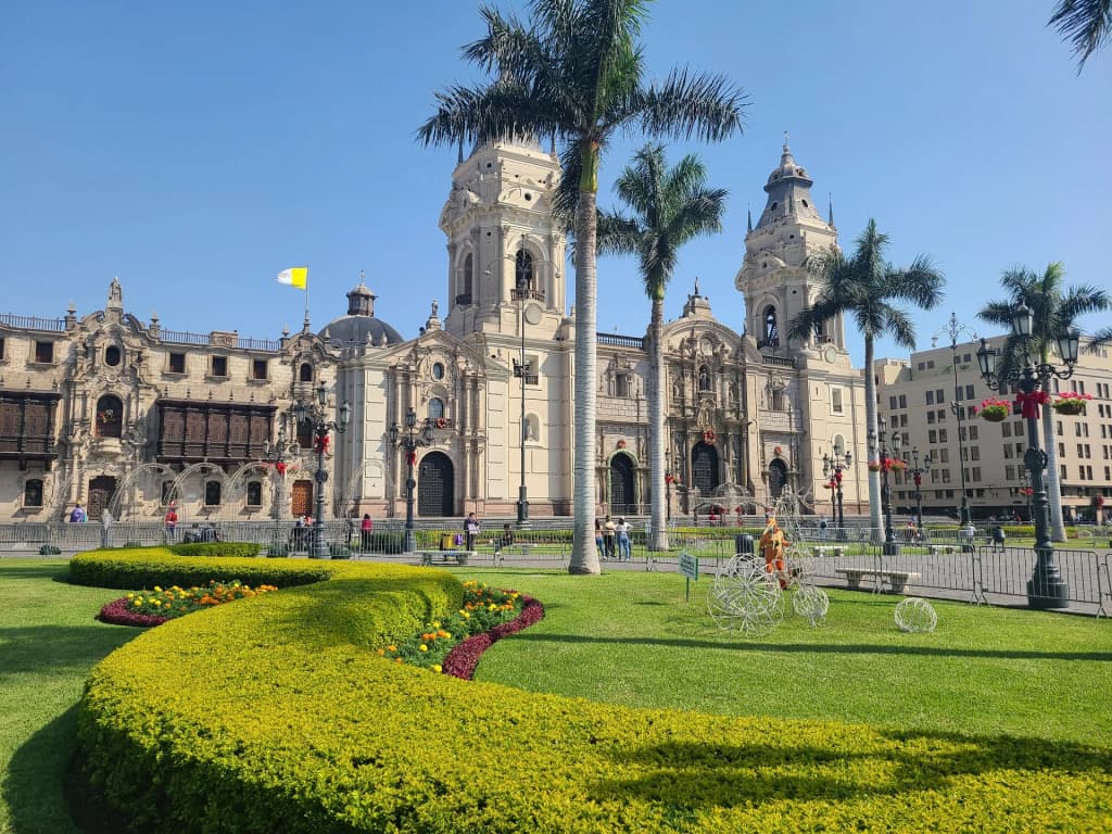 Historic architecture and bright yellow buildings of Plaza Mayor Lima