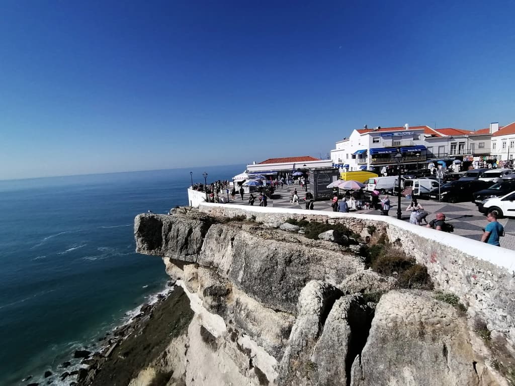 The massive, sweeping coastline and crashing waves of Nazaré Beach