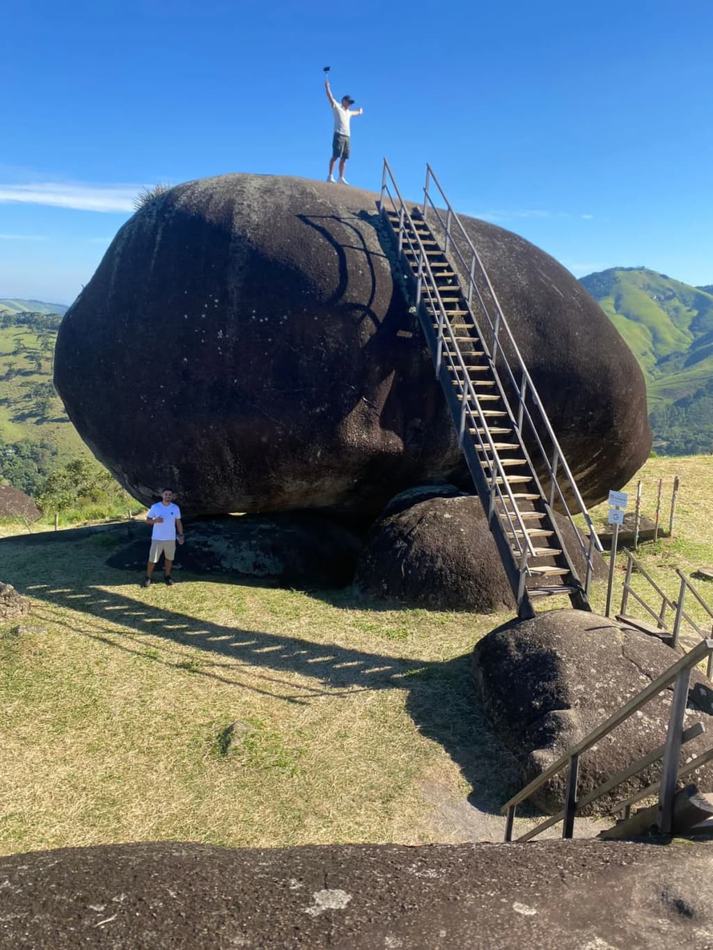 The jagged granite edge of Pedra de São Francisco overlooking the sprawling green valley