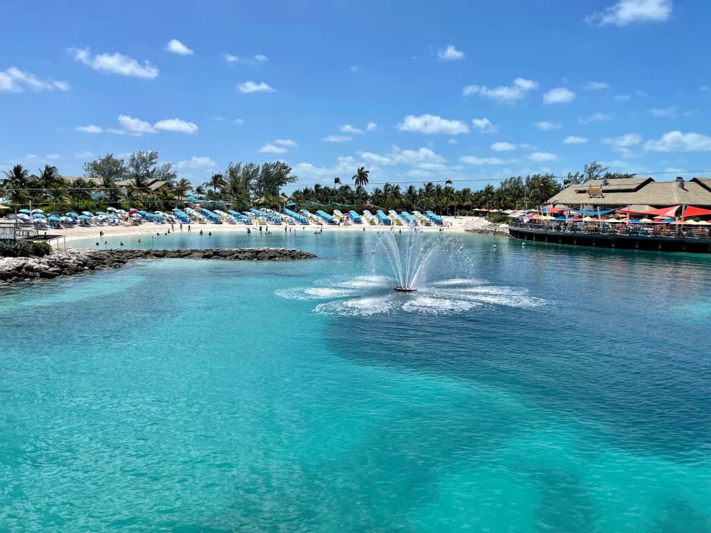 Sunny day at the pool deck on Wonder of the Seas with colorful water slides