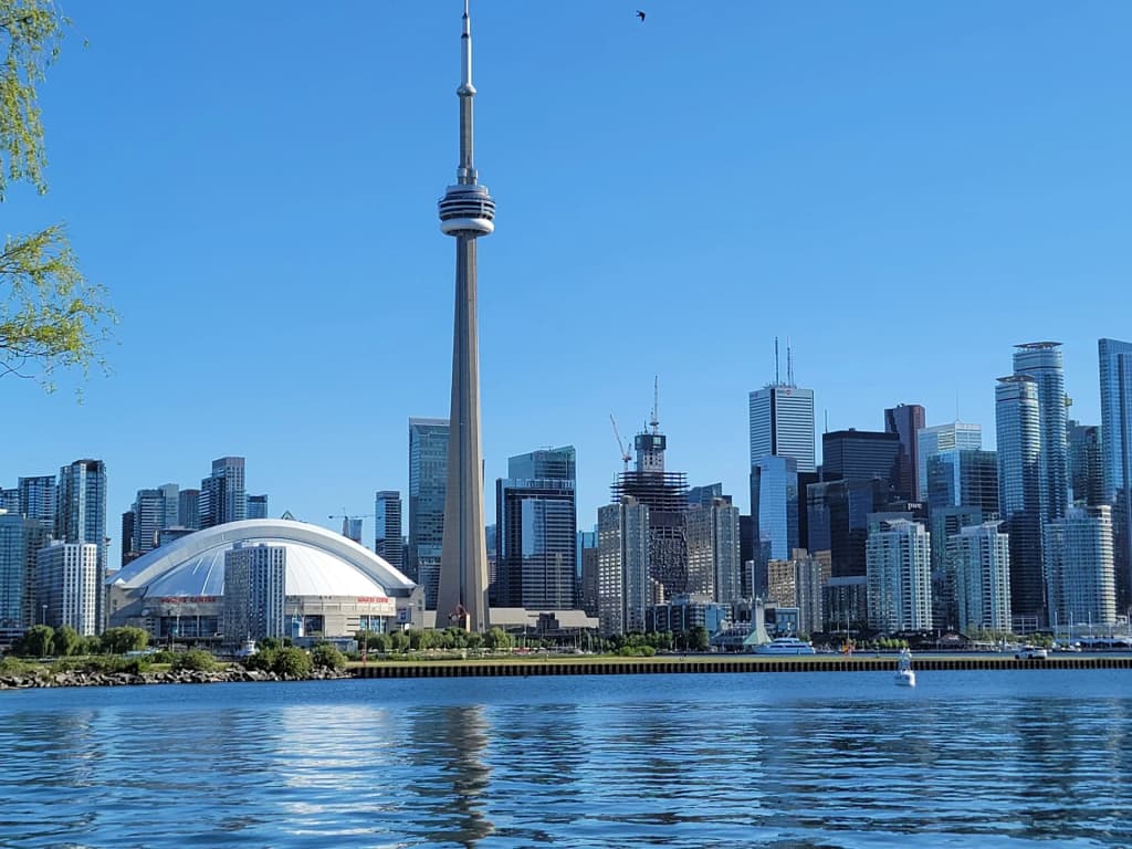 Toronto skyline towering over the lake