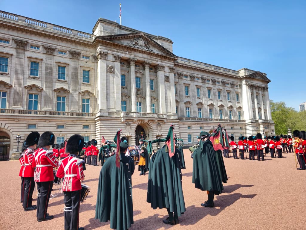 Buckingham Palace with tourists and iconic gates