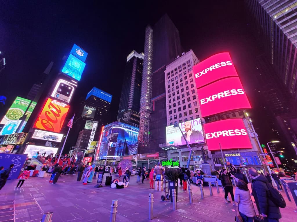 The towering energy of Times Square billboards