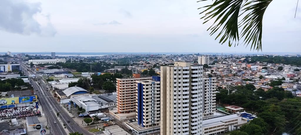 A stunning golden sunset reflecting off the vast waters of the Amazonas state
