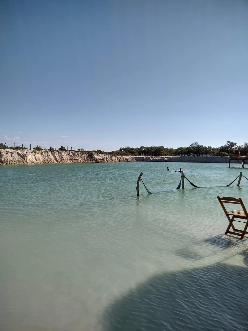 Hammocks resting in the crystal clear waters of Lagoa de Jijoca