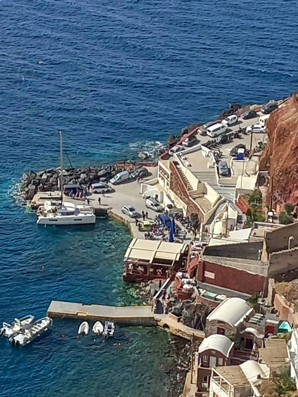 Whitewashed architecture of Oia cascading down the cliffside