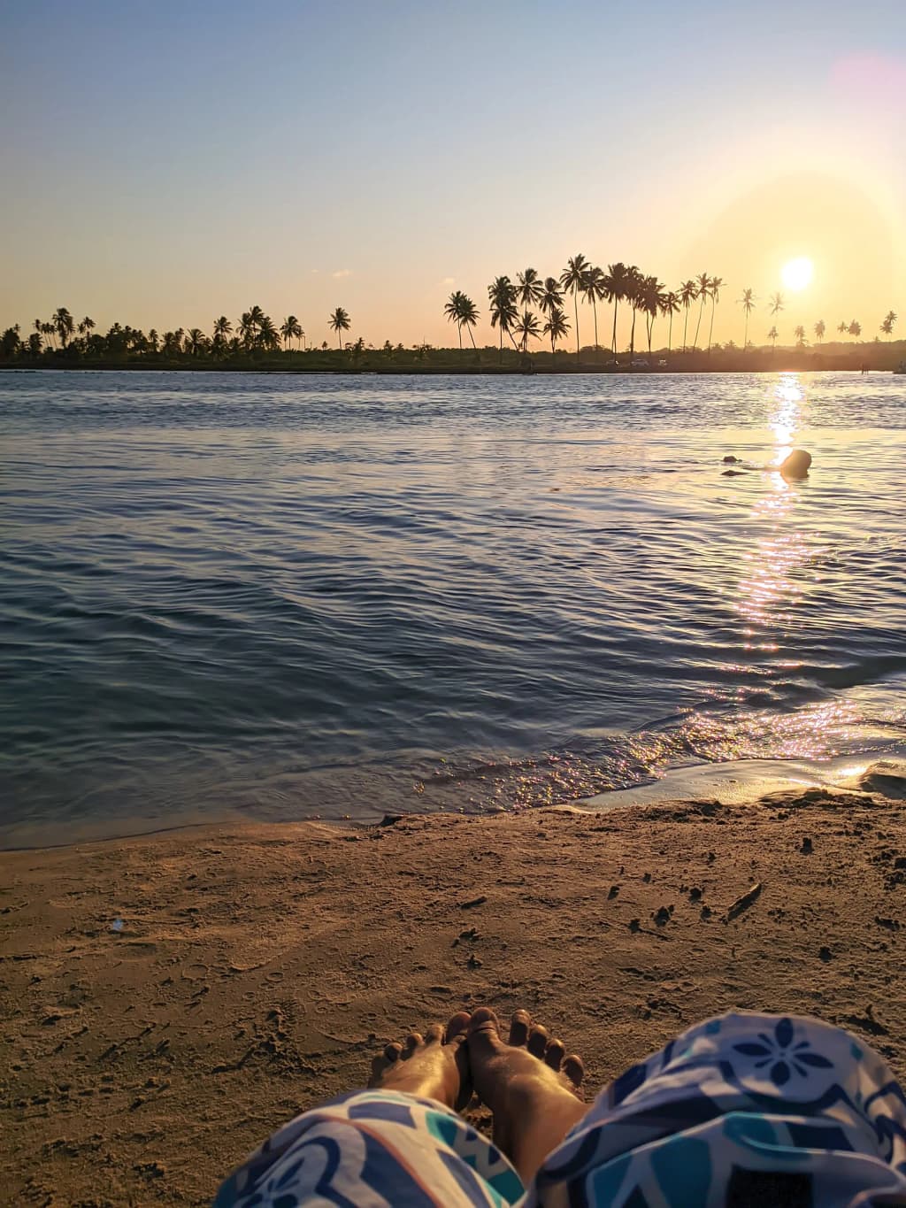 Golden hour hitting the calm waters of Pontal de Maracaipe