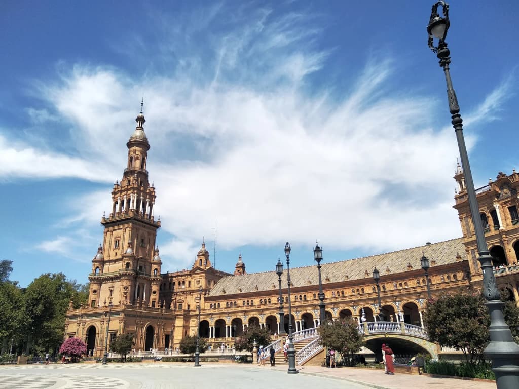 Ornate gardens and palace walls at the Alcazar of Seville