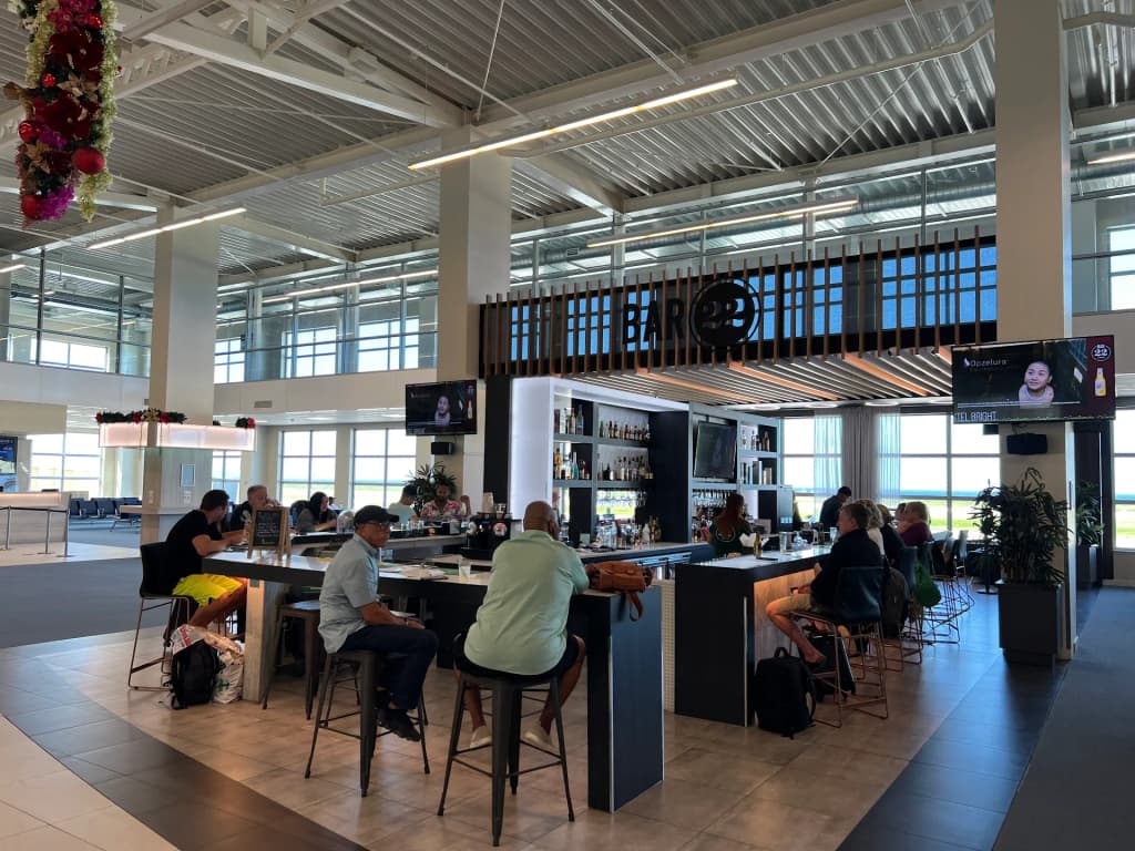 The modern facade of Curaçao International Airport at dusk