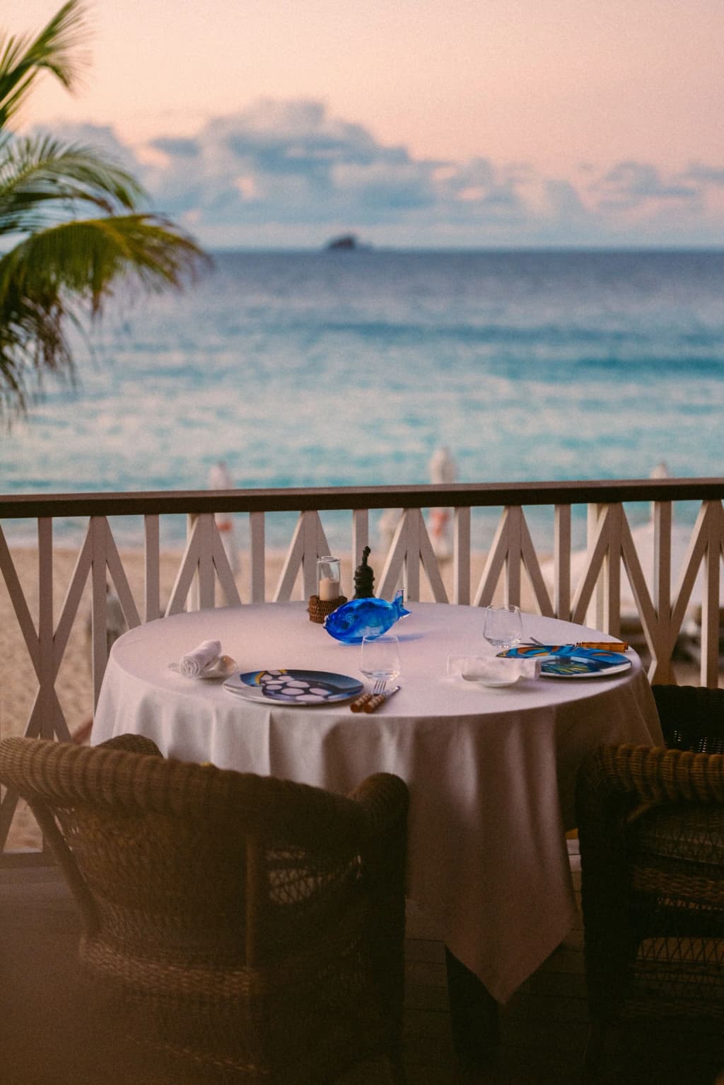 Elegant table settings at La Case de L'Isle restaurant under the warm Saint Barthélemy evening light