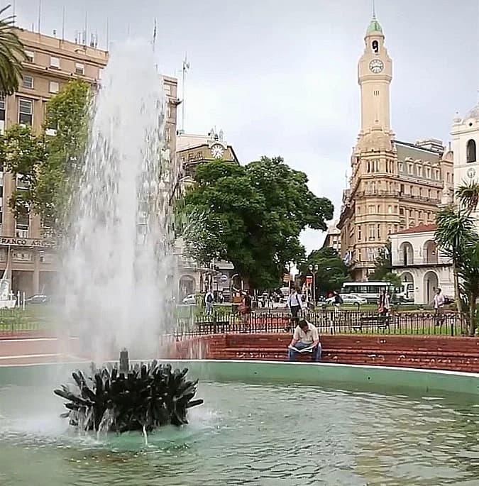 A classic Buenos Aires street scene with beautiful architecture and trees
