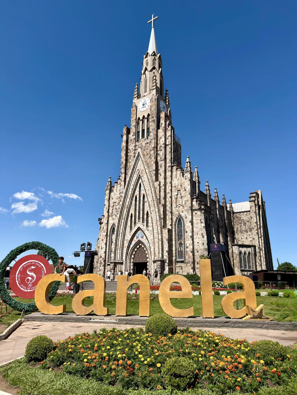 The towering Gothic structure of the Cathedral of Stone illuminated in the center of Canela