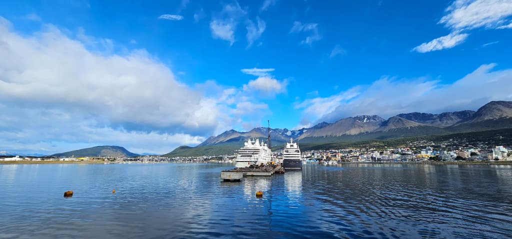 Ushuaia city framed by dramatic mountains and the Beagle Channel