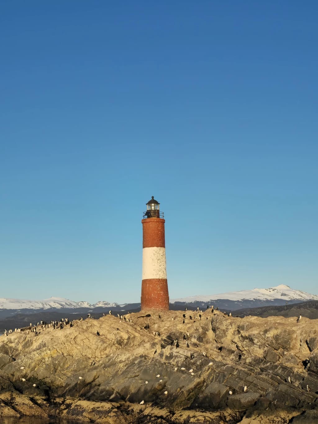 Les Éclaireurs Lighthouse standing guard over the rough waters of the Beagle Channel