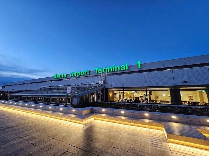 Travelers maintaining respectful distance at Narita Airport baggage claim