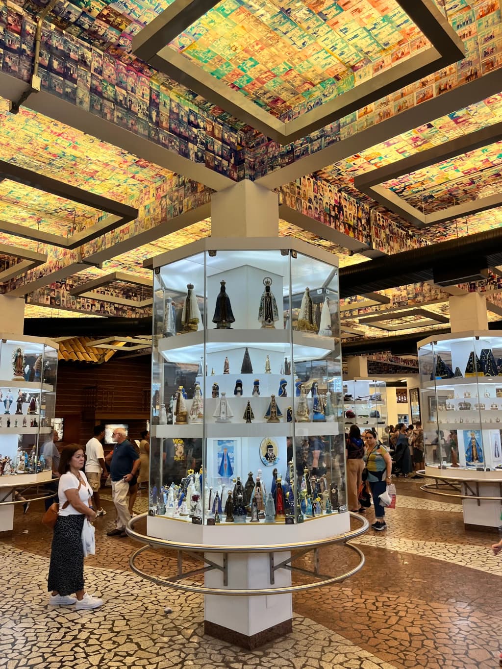 Sala das Promessas filled with photos and offerings in Aparecida