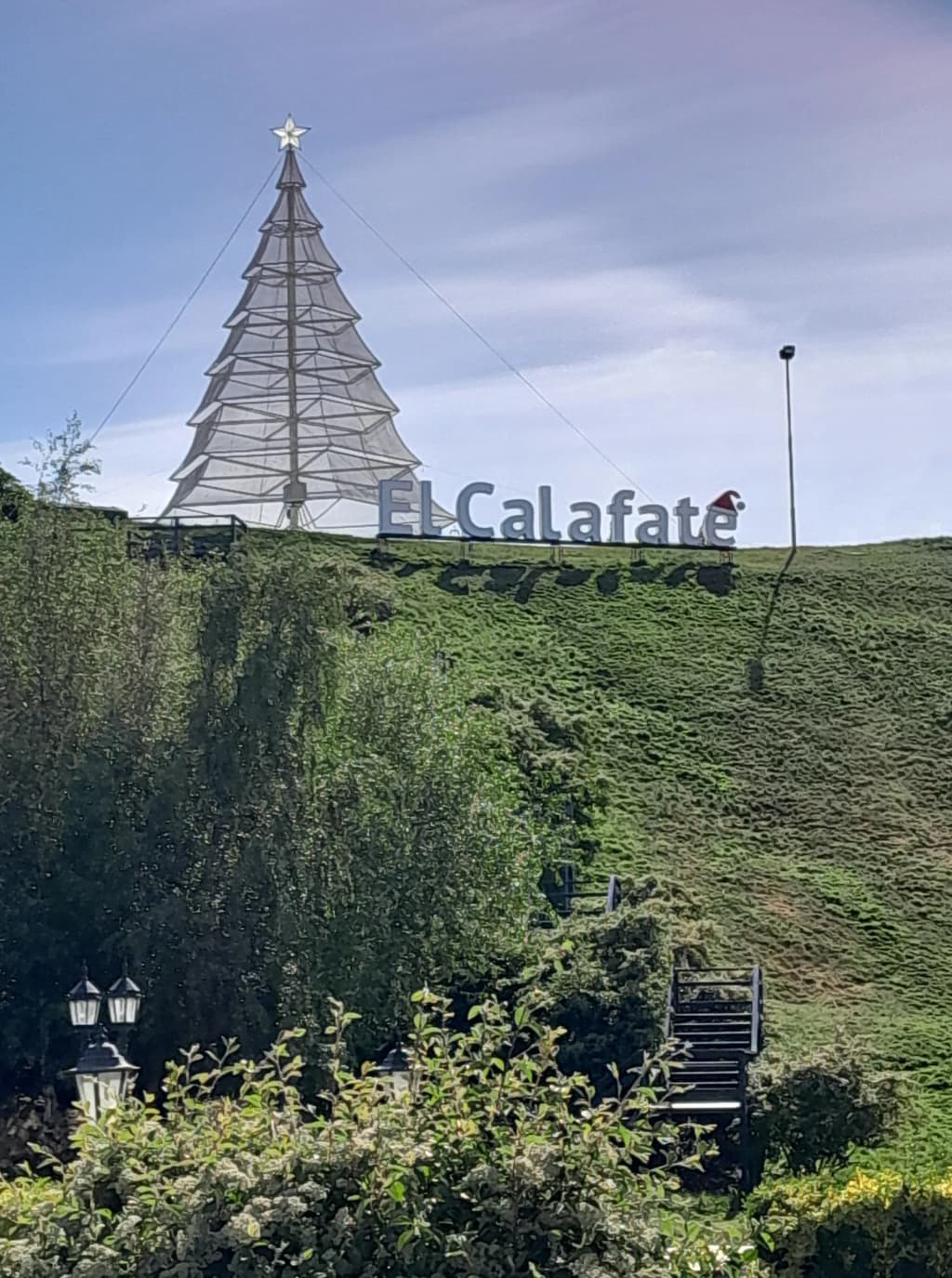 El Calafate town sign with mountains in the background