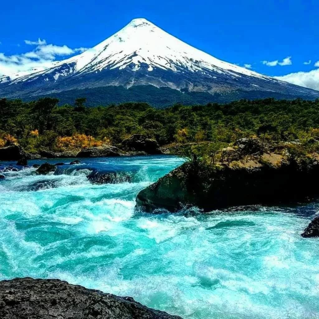 Raging turquoise waters rushing through the rocky Saltos de Petrohué