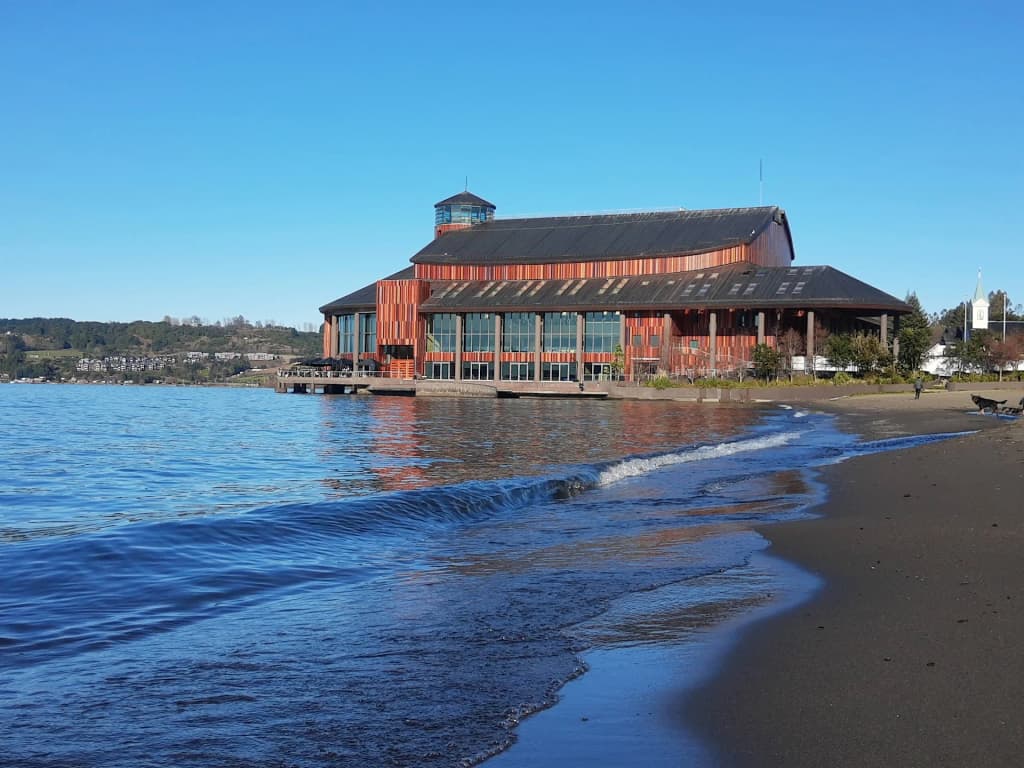 The charming wooden pier extending into the calm waters of Frutillar