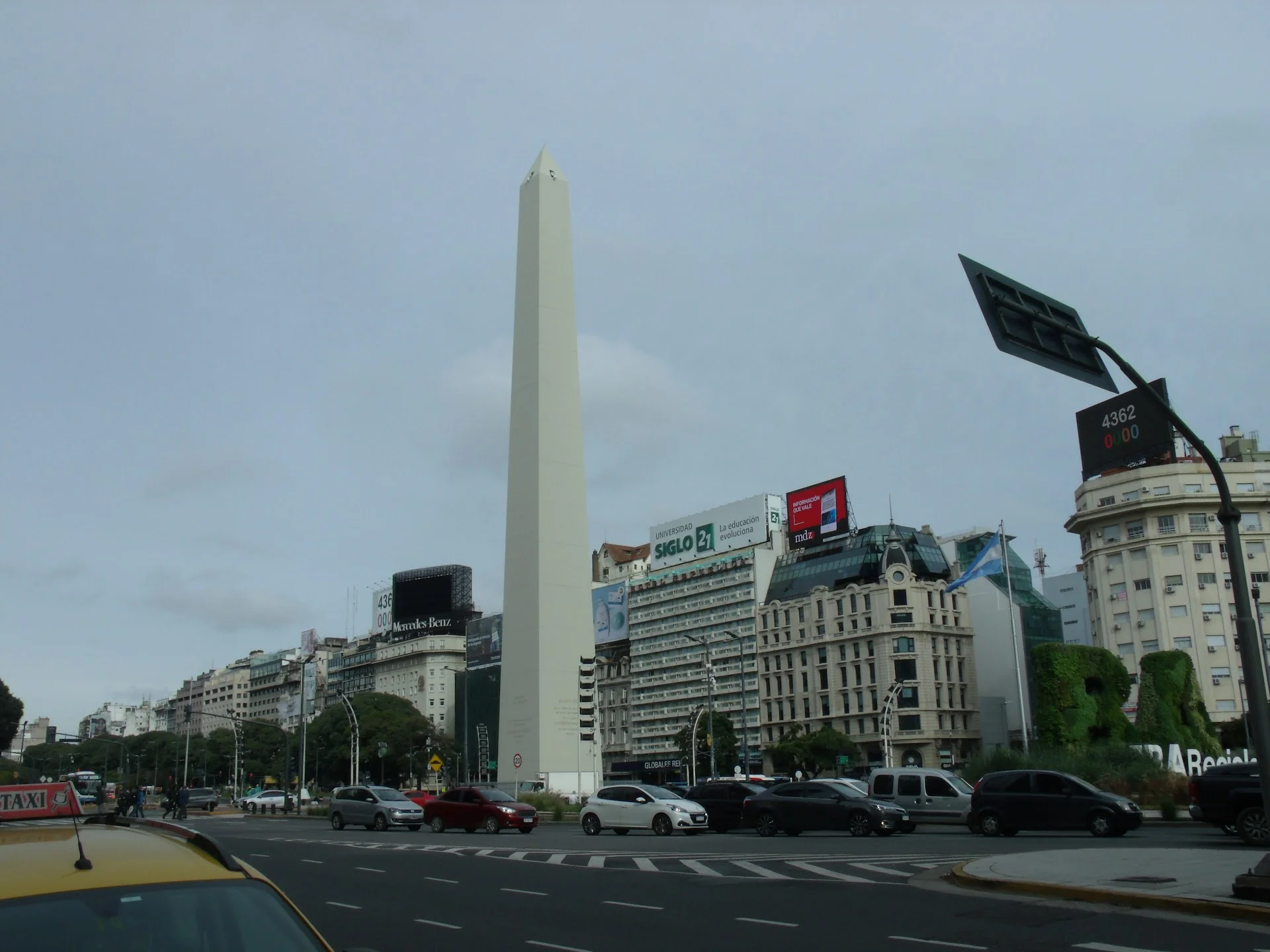The towering Obelisk cutting through the chaotic traffic of downtown Buenos Aires