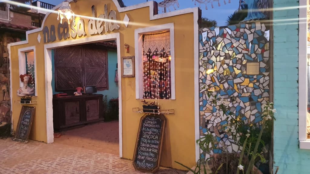 Warm, rustic, and intimate dining atmosphere inside Na Casa Dela