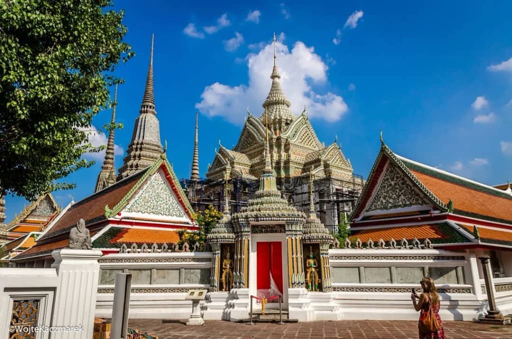 Golden statues and intricate architecture at the Grand Palace