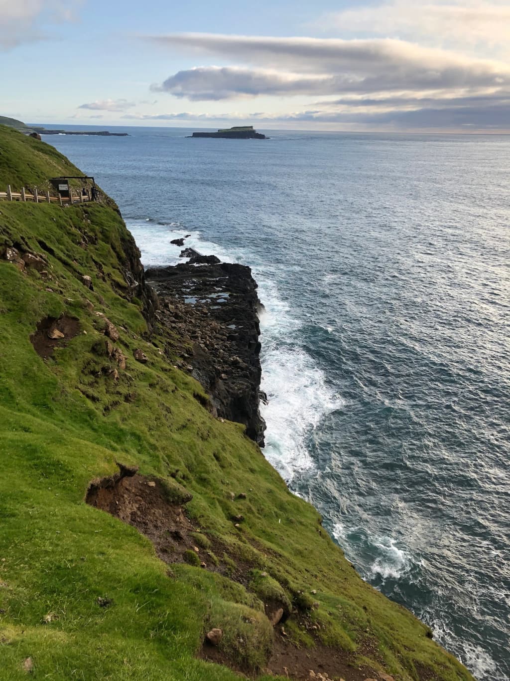 Múlafossur Waterfall plunging into the ocean at Gásadalur