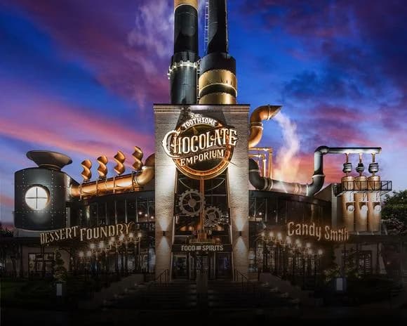 The vibrant, neon-lit entrance to Universal CityWalk Orlando at dawn