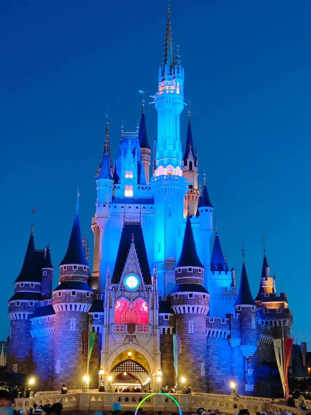 Tokyo Disneyland Castle towering above the crowds