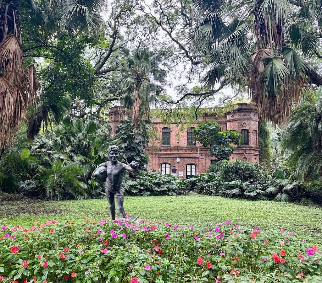 Morning light filtering through the historic Art Nouveau greenhouse in the Jardín Botánico Carlos Thays
