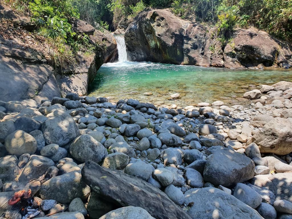 Emerald green waters of Cachoeira da Pedreira in Lavrinhas