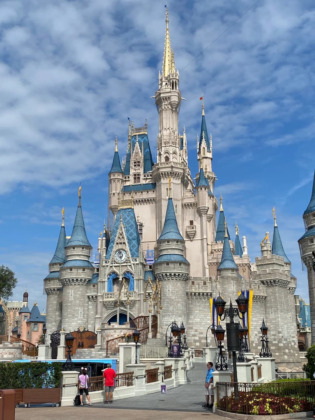Morning light catching the gold spires of Cinderella Castle at the end of Main Street