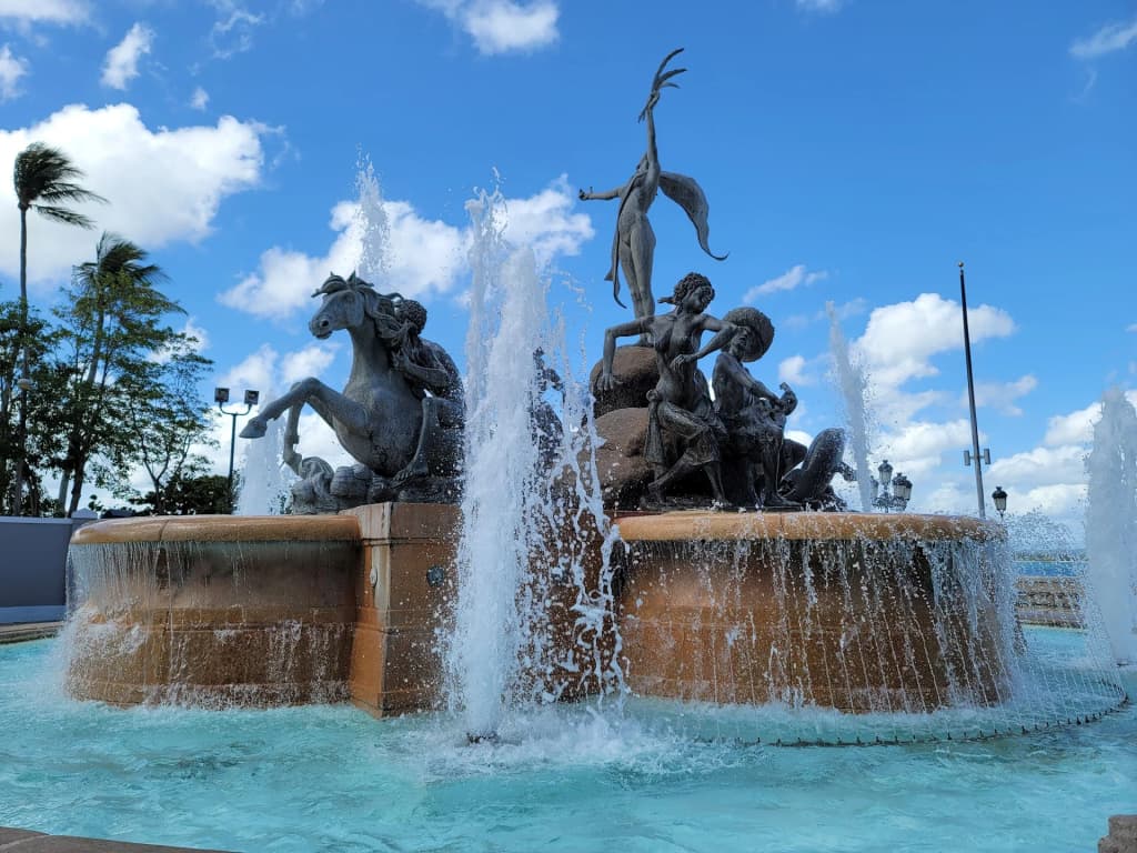Colorful colonial architecture lining the historic streets of San Juan under a bright sky