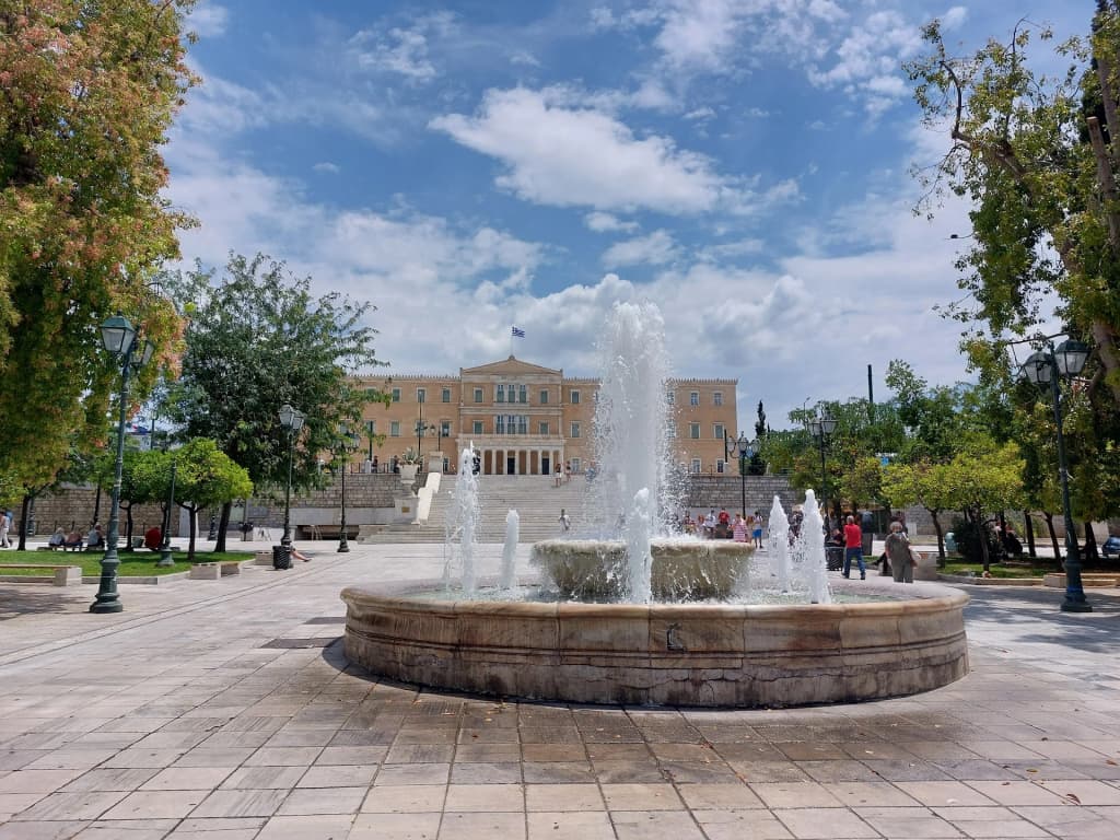 The bustling atmosphere of Syntagma Square in the heart of modern Athens