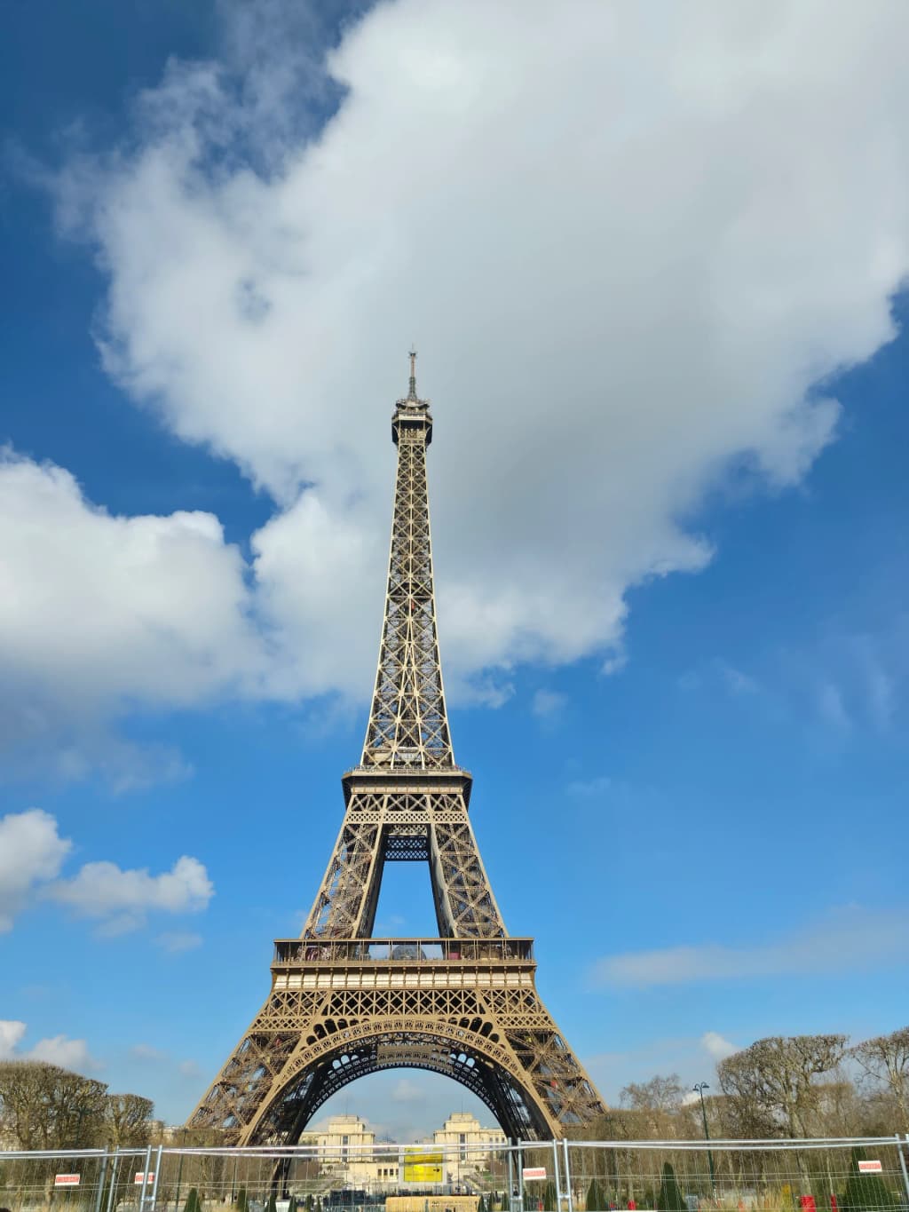 Eiffel Tower viewed from a classic Parisian street