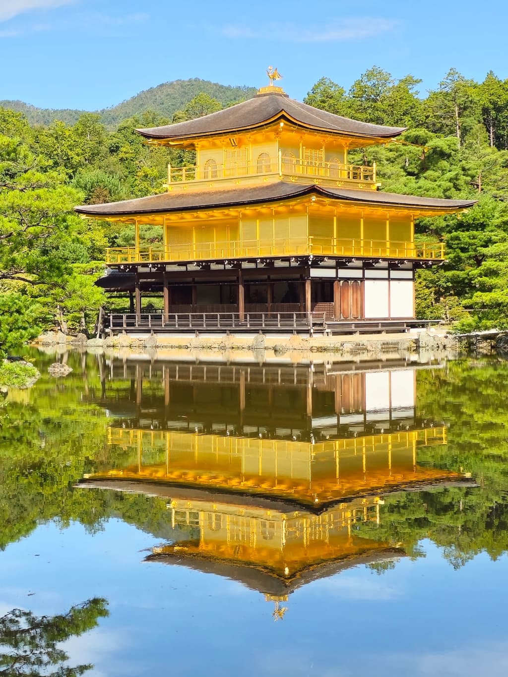 The stunning reflection of Kinkaku-ji Golden Pavilion on the water