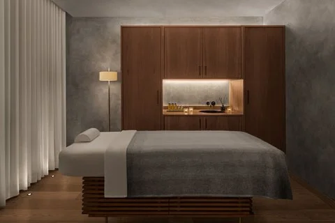 The blackened wood facade of The Reykjavik EDITION glowing under the Icelandic sky