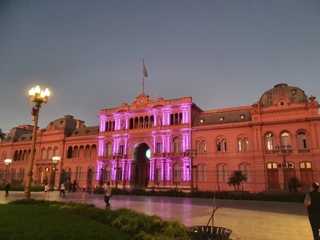 The iconic pink facade of the Casa Rosada standing proud in Plaza de Mayo