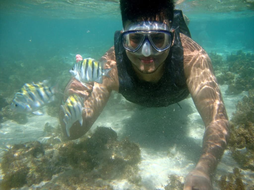 Tourists enjoying the blue waters of Maragogi Natural pools