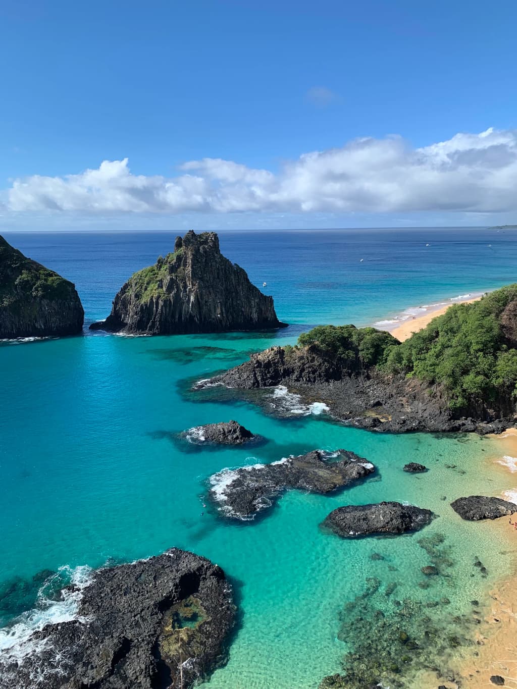 Iconic view of Morro Dois Irmãos rising from the turquoise waters of Fernando de Noronha